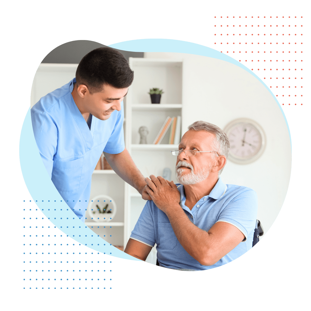 A doctor listens intently to an elderly patient during an unhurried consultation in a comfortable and private office setting.