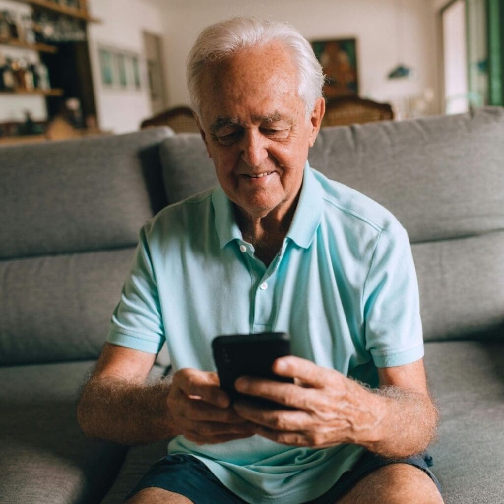 Old man using his phone
