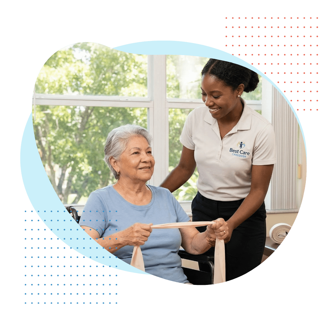 An elderly Latina woman with silver hair is seated in a wheelchair, holding a light resistance band. A smiling younger Black female Best Care caregiver wearing a neat Best Care polo shirt with a logo, stands beside her, encouraging her during a gentle physical therapy session