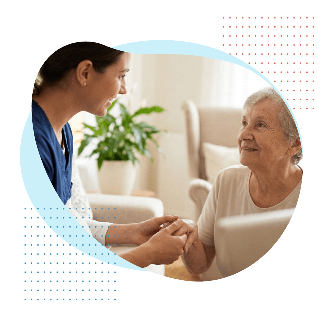 A close-up, square photograph capturing a warm, trusted interaction: a compassionate Best Care female caregiver gently holds the hand of an elderly woman inside a comfortable, well-lit Pembroke Pines home.