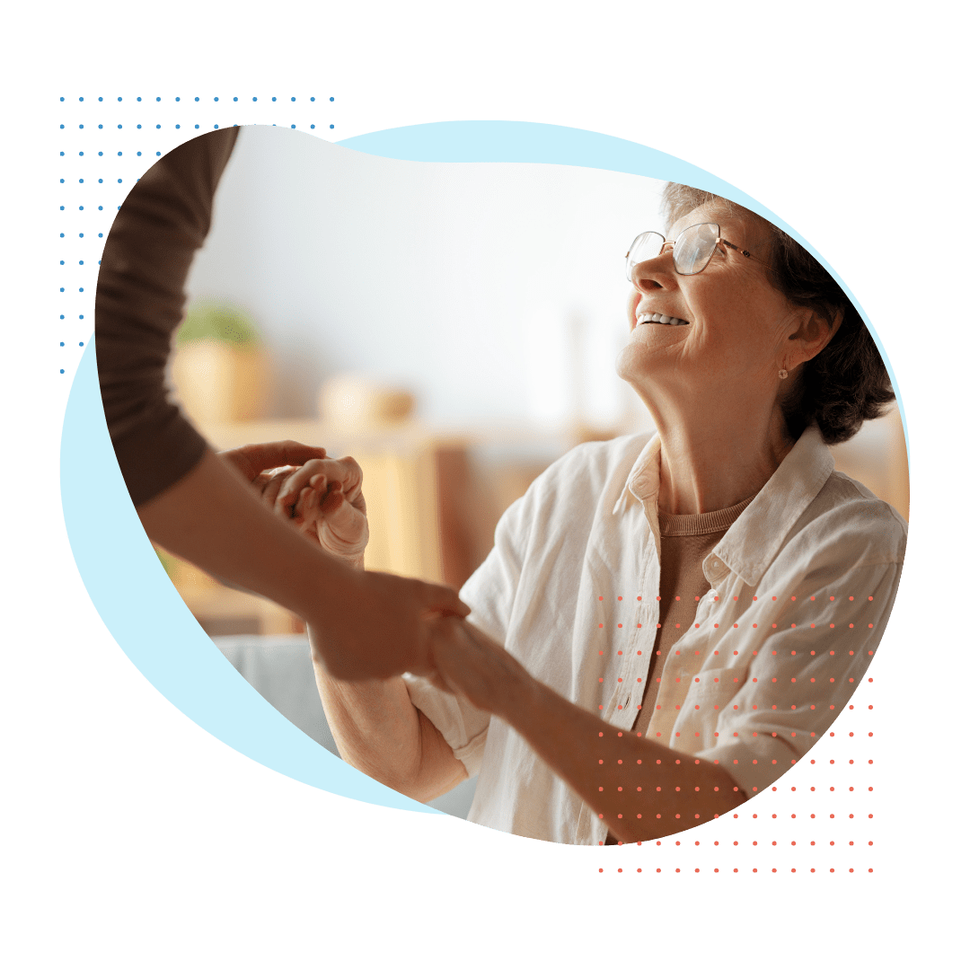 happy eldlery patient looking up a nurse